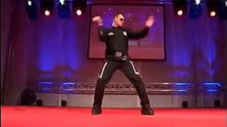 Muscled and sexy stud in uniform dancing porn video
